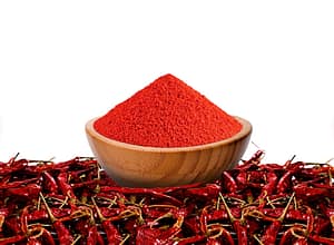 Bowl with red chili powder on transparent PNG background.